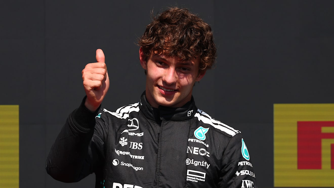 MONTREAL, QUEBEC - JUNE 15: Third placed Andrea Kimi Antonelli of Italy and Mercedes AMG Petronas F1 Team gives a thumbs up on the podium during the F1 Grand Prix of Canada at Circuit Gilles-Villeneuve on June 15, 2025 in Montreal, Quebec. (Photo by Clive Rose/Getty Images)