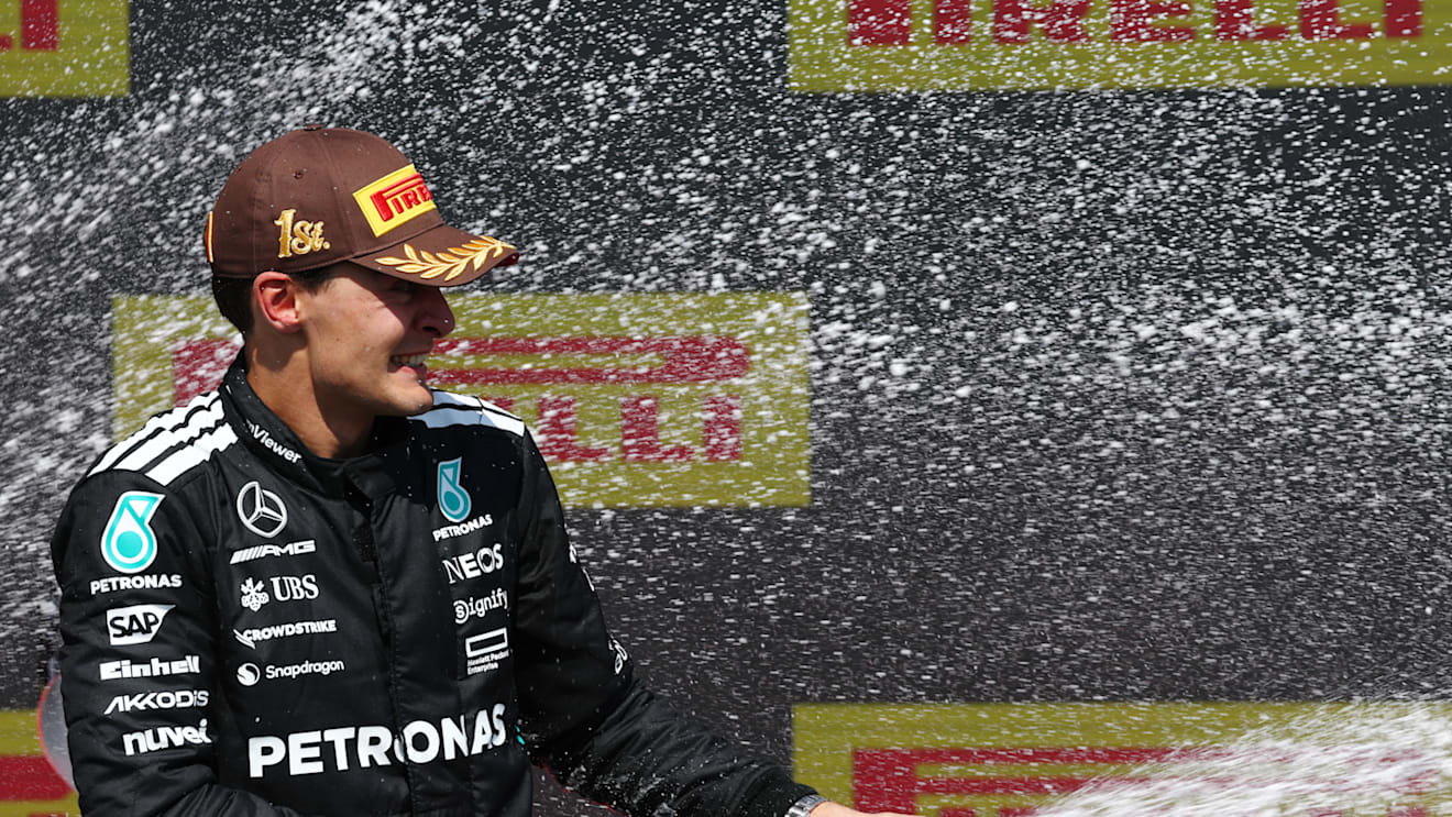 MONTREAL, QUEBEC - JUNE 15: Race winner George Russell of Great Britain and Mercedes AMG Petronas F1 Team celebrates on the podium during the F1 Grand Prix of Canada at Circuit Gilles-Villeneuve on June 15, 2025 in Montreal, Quebec. (Photo by Clive Rose/Getty Images)