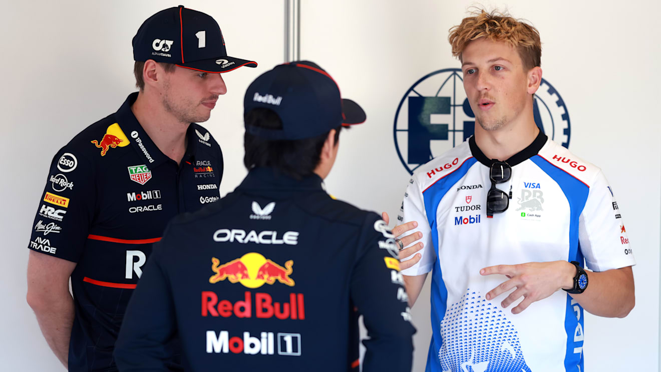 IMOLA, ITALY - MAY 18: Max Verstappen of the Netherlands and Oracle Red Bull Racing Yuki Tsunoda of Japan and Oracle Red Bull Racing and Liam Lawson of New Zealand and Visa Cash App Racing Bulls talk prior to the F1 Grand Prix of Emilia-Romagna at Autodromo Internazionale Enzo e Dino Ferrari on May 18, 2025 in Imola, Italy. (Photo by Mark Thompson/Getty Images)