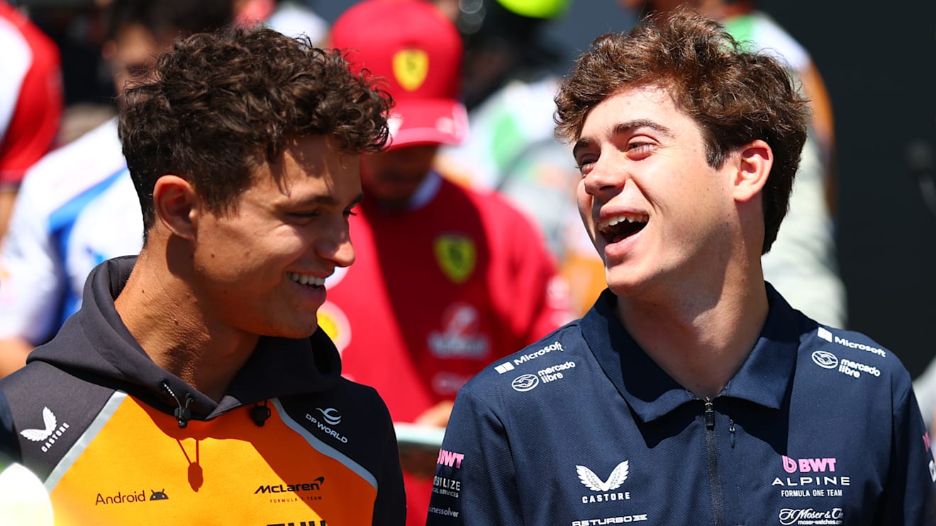 IMOLA, ITALY - MAY 18: Lando Norris of Great Britain and McLaren and Franco Colapinto of Argentina and Alpine F1 talk on the drivers parade prior to the F1 Grand Prix of Emilia-Romagna at Autodromo Internazionale Enzo e Dino Ferrari on May 18, 2025 in Imola, Italy. (Photo by Bryn Lennon - Formula 1/Formula 1 via Getty Images)