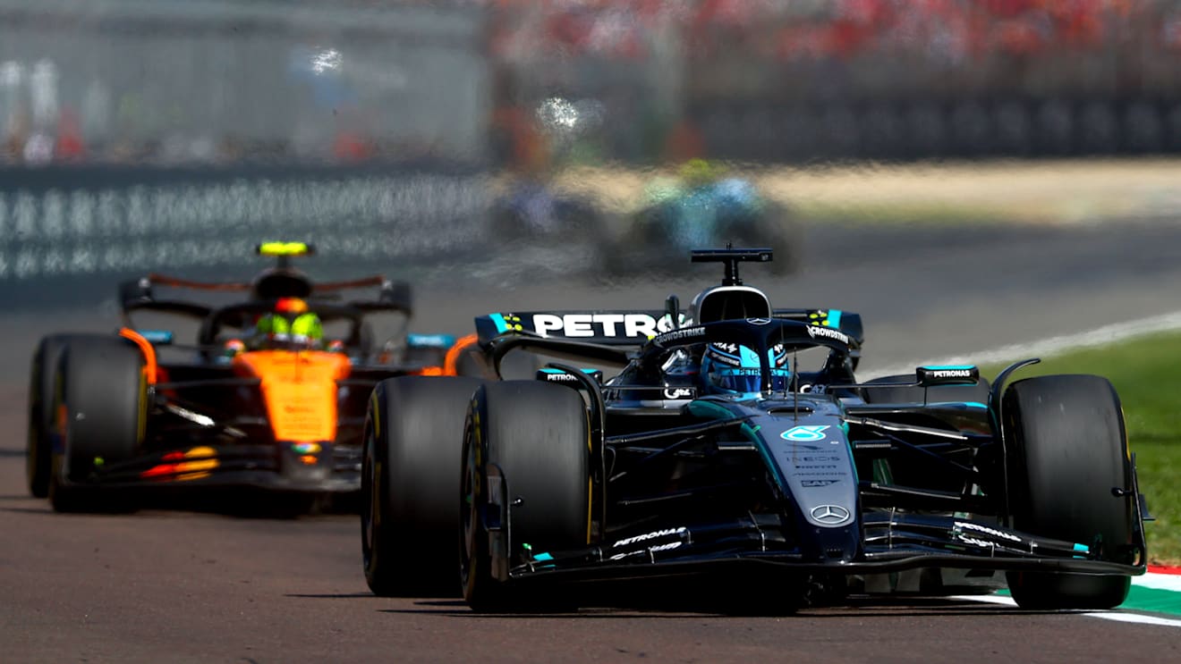 IMOLA, ITALY - MAY 18: George Russell of Great Britain driving the (63) Mercedes AMG Petronas F1 Team W16 leads Lando Norris of Great Britain driving the (4) McLaren MCL39 Mercedes on track during the F1 Grand Prix of Emilia-Romagna at Autodromo Internazionale Enzo e Dino Ferrari on May 18, 2025 in Imola, Italy. (Photo by Bryn Lennon - Formula 1/Formula 1 via Getty Images)