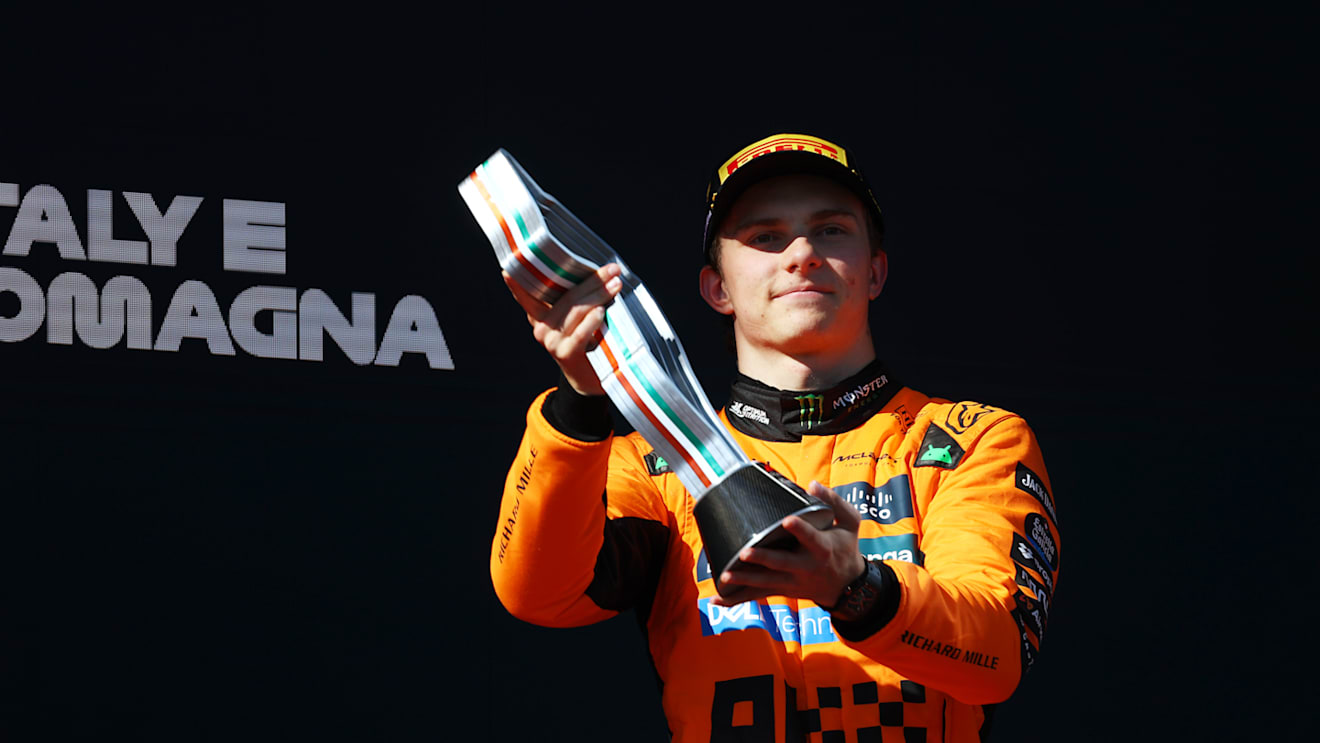 IMOLA, ITALY - MAY 18: Third placed Oscar Piastri of Australia and McLaren lifts his trophy on the podium during the F1 Grand Prix of Emilia-Romagna at Autodromo Internazionale Enzo e Dino Ferrari on May 18, 2025 in Imola, Italy. (Photo by Clive Rose/Getty Images)