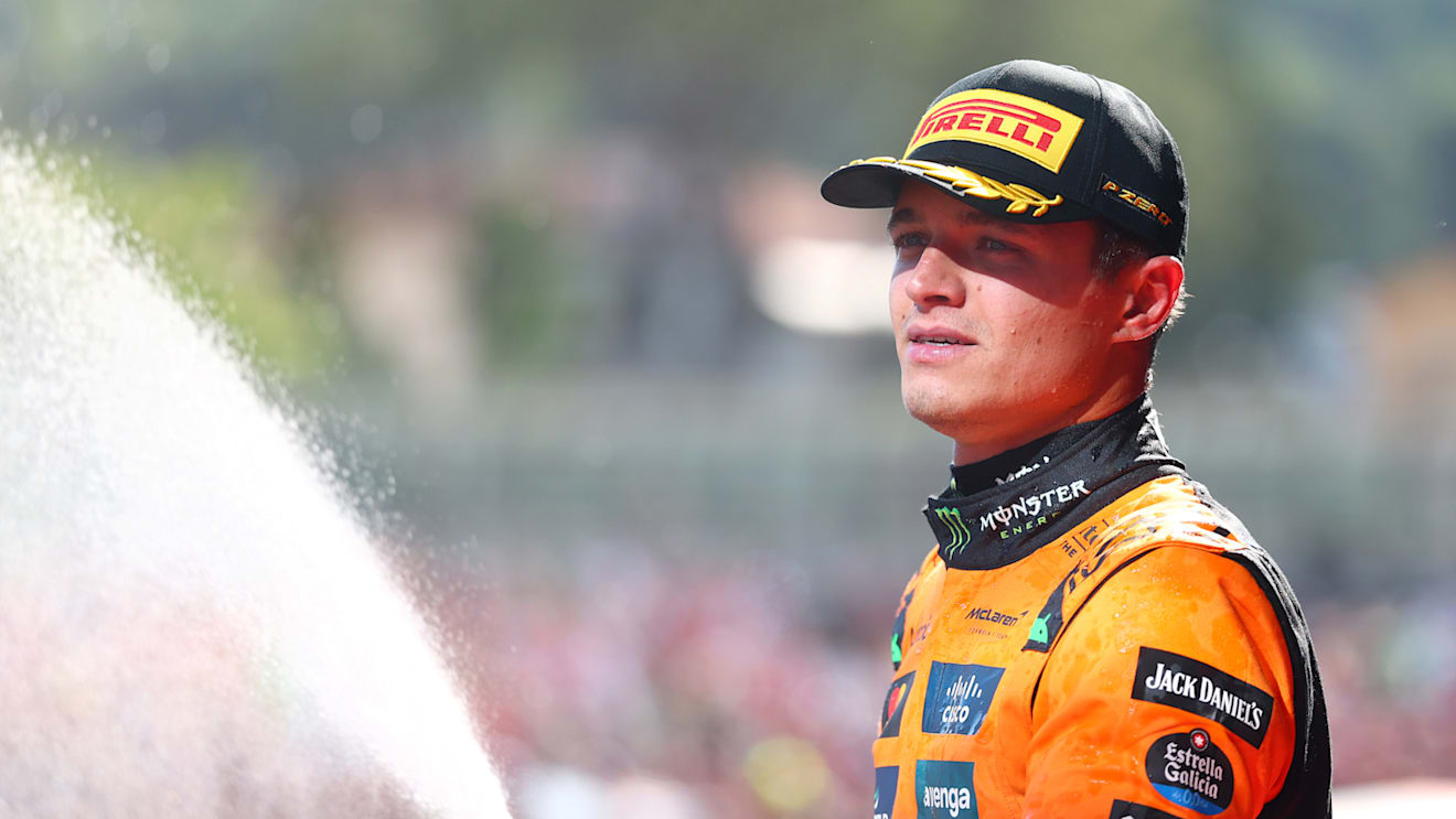 IMOLA, ITALY - MAY 18: Second placed Lando Norris of Great Britain and McLaren sprays Champagne on the podium during the F1 Grand Prix of Emilia-Romagna at Autodromo Internazionale Enzo e Dino Ferrari on May 18, 2025 in Imola, Italy. (Photo by Bryn Lennon - Formula 1/Formula 1 via Getty Images)