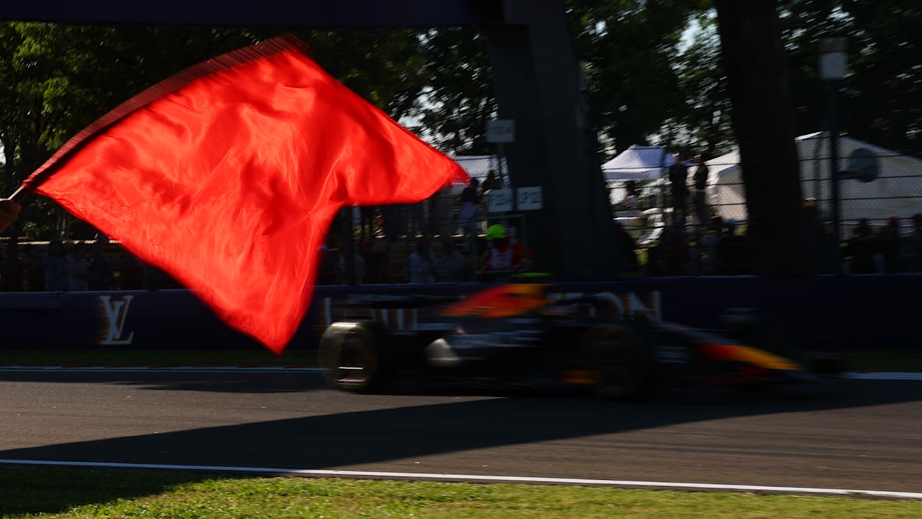 IMOLA, ITALY - MAY 16: A marshal waves a red flag as Yuki Tsunoda of Japan driving the (22) Oracle Red Bull Racing RB21 passes during practice ahead of the F1 Grand Prix of Emilia-Romagna at Autodromo Internazionale Enzo e Dino Ferrari on May 16, 2025 in Imola, Italy. (Photo by Mark Thompson/Getty Images)