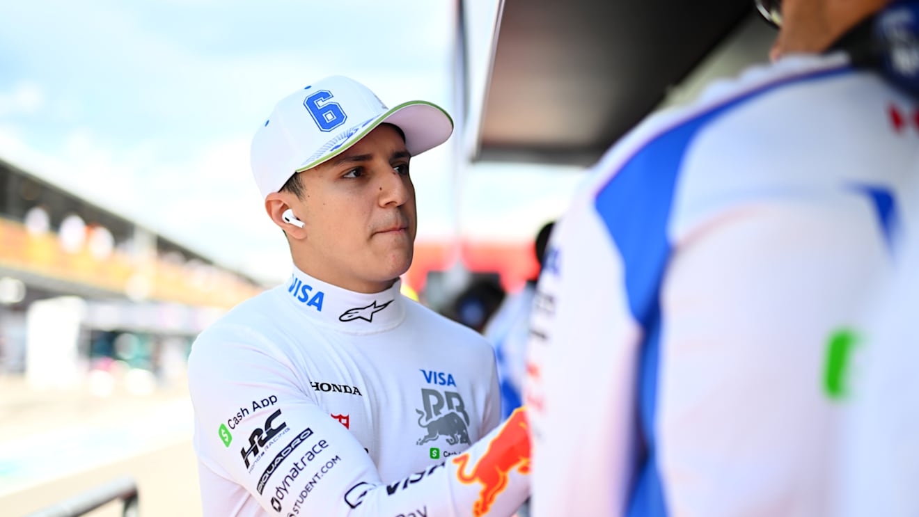 IMOLA, ITALY - MAY 17: Isack Hadjar of France and Visa Cash App Racing Bulls greets a teammate on the pit wall during qualifying ahead of the F1 Grand Prix of Emilia-Romagna at Autodromo Internazionale Enzo e Dino Ferrari on May 17, 2025 in Imola, Italy. (Photo by Rudy Carezzevoli/Getty Images)