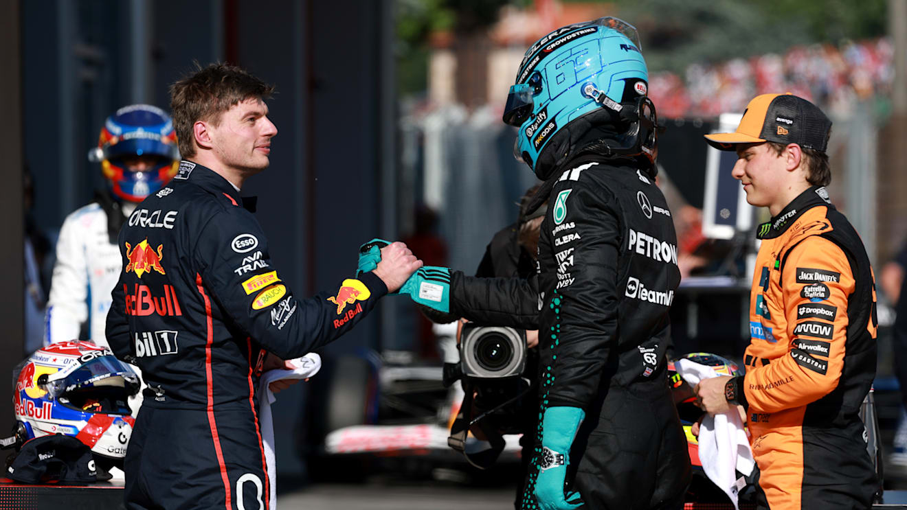 IMOLA, ITALY - MAY 17: Second placed qualifier Max Verstappen of the Netherlands and Oracle Red Bull Racing and Third placed qualifier George Russell of Great Britain and Mercedes AMG Petronas F1 Team congratulate each other in parc ferme during qualifying ahead of the F1 Grand Prix of Emilia-Romagna at Autodromo Internazionale Enzo e Dino Ferrari on May 17, 2025 in Imola, Italy. (Photo by Mark Thompson/Getty Images)