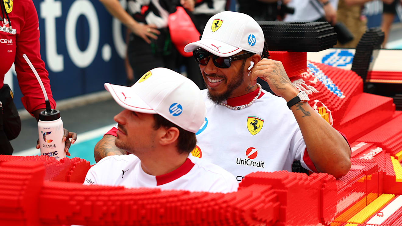 MIAMI, FLORIDA - MAY 04: Charles Leclerc of Monaco and Scuderia Ferrari and Lewis Hamilton of Great Britain and Scuderia Ferrari at the Lego drivers parade prior to the F1 Grand Prix of Miami at Miami International Autodrome on May 04, 2025 in Miami, Florida. (Photo by Bryn Lennon - Formula 1/Formula 1 via Getty Images)