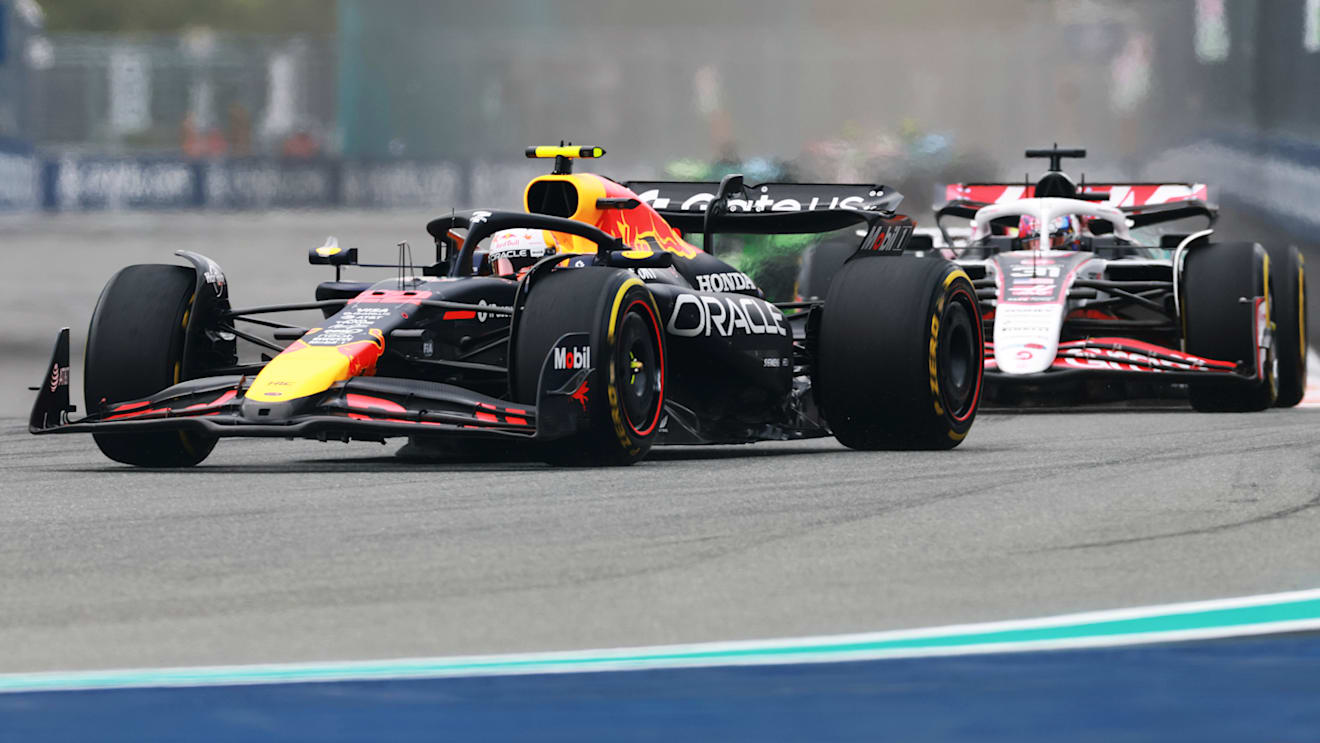 MIAMI, FLORIDA - MAY 04: Yuki Tsunoda of Japan driving the (22) Oracle Red Bull Racing RB21 leads Esteban Ocon of France driving the (31) Haas F1 VF-25 Ferrari on track during the F1 Grand Prix of Miami at Miami International Autodrome on May 04, 2025 in Miami, Florida. (Photo by Mark Thompson/Getty Images)