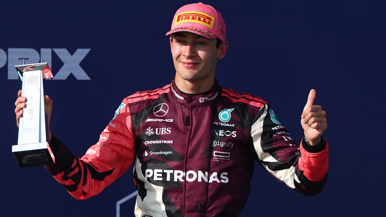 MIAMI, FLORIDA - MAY 04: Third placed George Russell of Great Britain and Mercedes AMG Petronas F1 Team on the podium with his trophy during the F1 Grand Prix of Miami at Miami International Autodrome on May 04, 2025 in Miami, Florida. (Photo by Clive Rose/Getty Images)