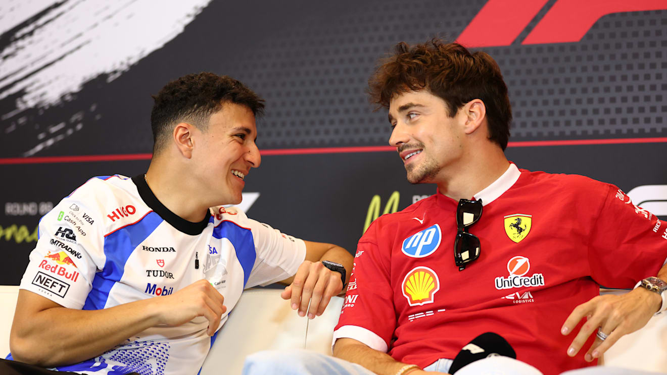 MONTE-CARLO, MONACO - MAY 22: Isack Hadjar of France and Visa Cash App Racing Bulls and Charles Leclerc of Monaco and Scuderia Ferrari talk in the Drivers Press Conference during previews ahead of the F1 Grand Prix of Monaco at Circuit de Monaco on May 22, 2025 in Monte-Carlo, Monaco. (Photo by Clive Rose/Getty Images)