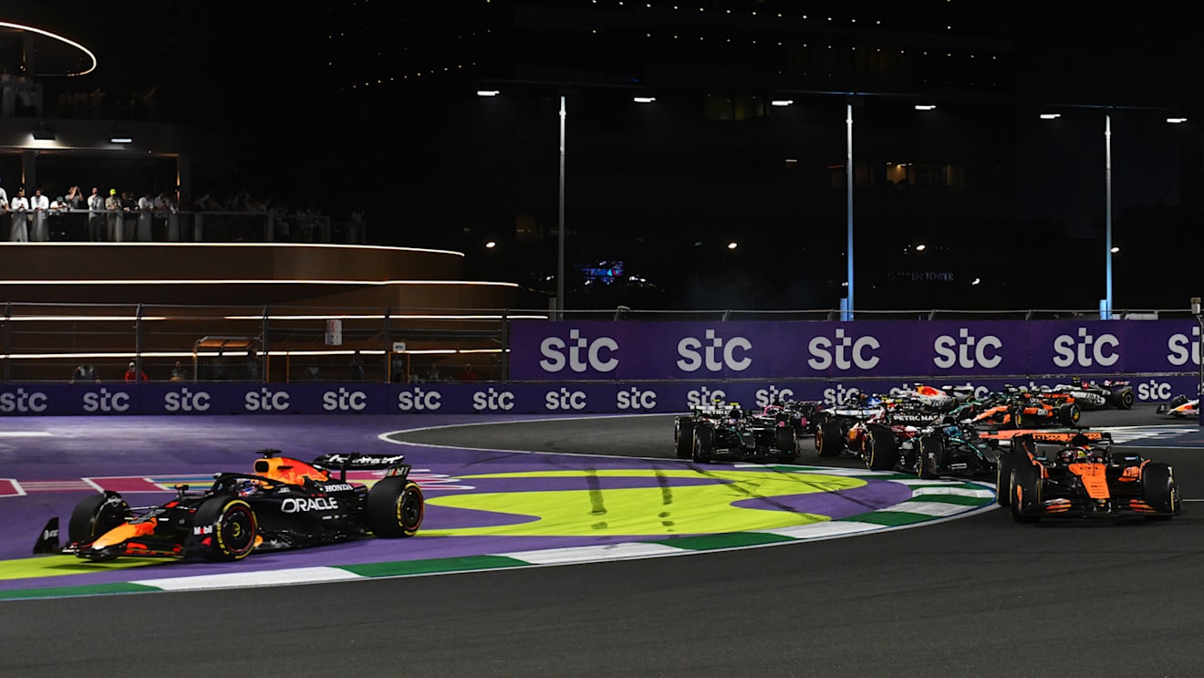 JEDDAH, SAUDI ARABIA - APRIL 20: Max Verstappen of the Netherlands driving the (1) Oracle Red Bull Racing RB21 runs wide as Oscar Piastri of Australia driving the (81) McLaren MCL39 Mercedes leads George Russell of Great Britain driving the (63) Mercedes AMG Petronas F1 Team W16 and the rest of the field at the start during the F1 Grand Prix of Saudi Arabia at Jeddah Corniche Circuit on April 20, 2025 in Jeddah, Saudi Arabia. (Photo by Rudy Carezzevoli/Getty Images)