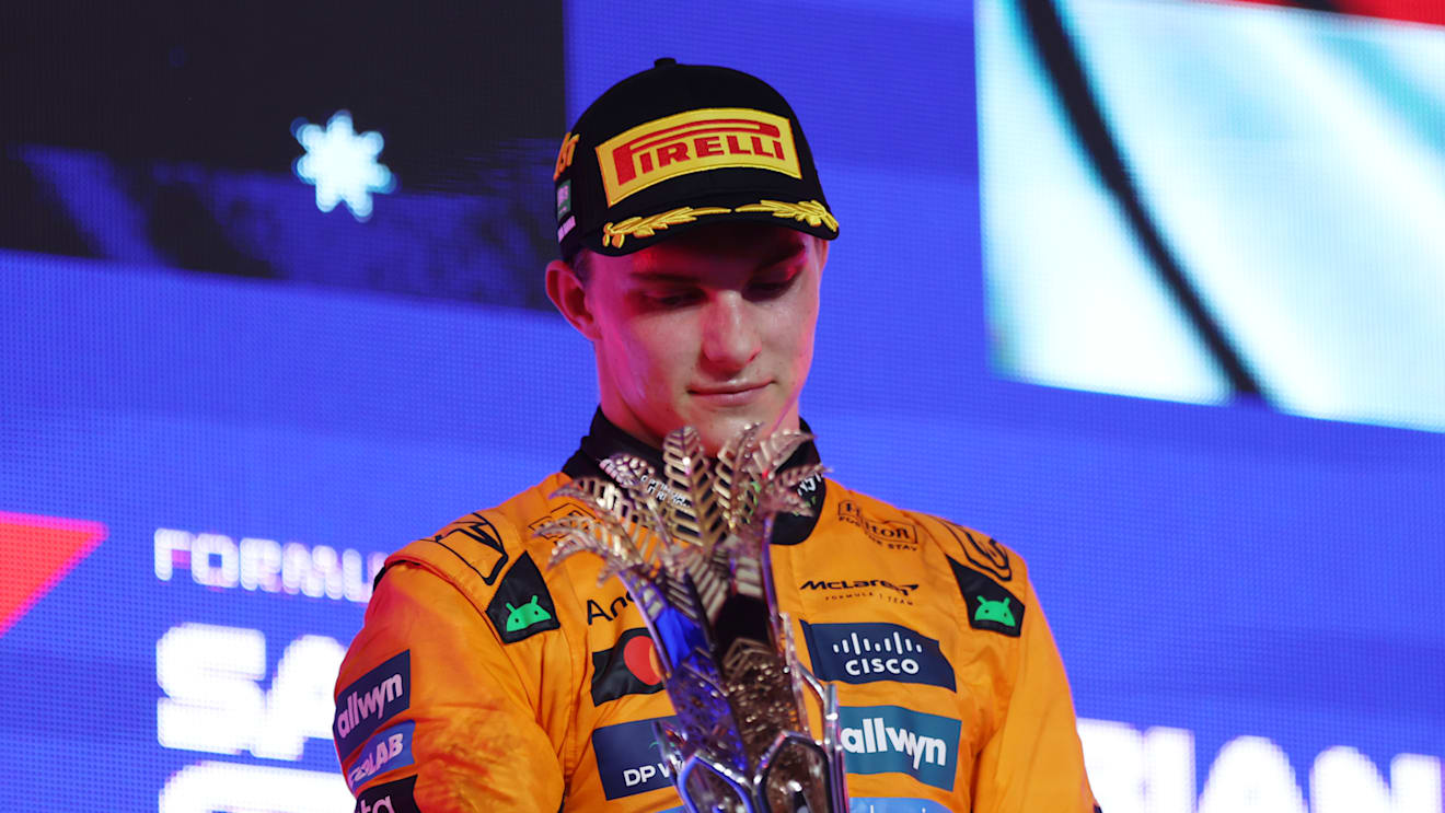 JEDDAH, SAUDI ARABIA - APRIL 20: Race winner Oscar Piastri of Australia and McLaren on the podium with his trophy during the F1 Grand Prix of Saudi Arabia at Jeddah Corniche Circuit on April 20, 2025 in Jeddah, Saudi Arabia. (Photo by Meg Oliphant/Getty Images)