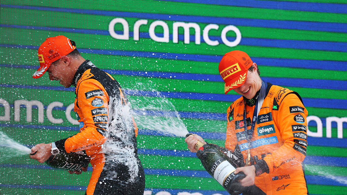 BARCELONA, SPAIN - JUNE 01: Race winner Oscar Piastri of Australia and McLaren and Second placed Lando Norris of Great Britain and McLaren celebrate on the podium during the F1 Grand Prix of Spain at Circuit de Barcelona-Catalunya on June 01, 2025 in Barcelona, Spain. (Photo by Mark Thompson/Getty Images)