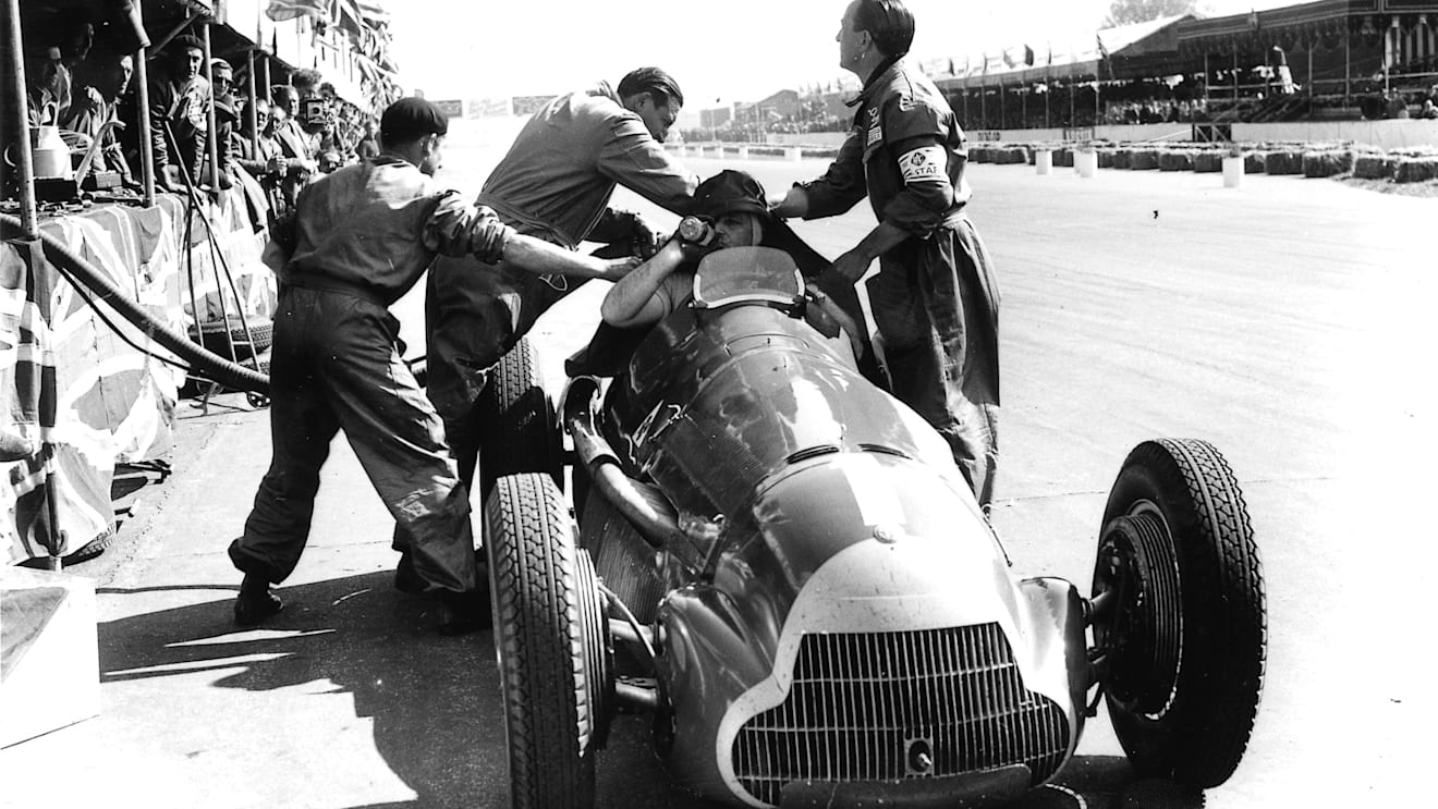 Alfa Romeo racer Juan Manuel Fangio makes a pit stop during the Grand Prix
