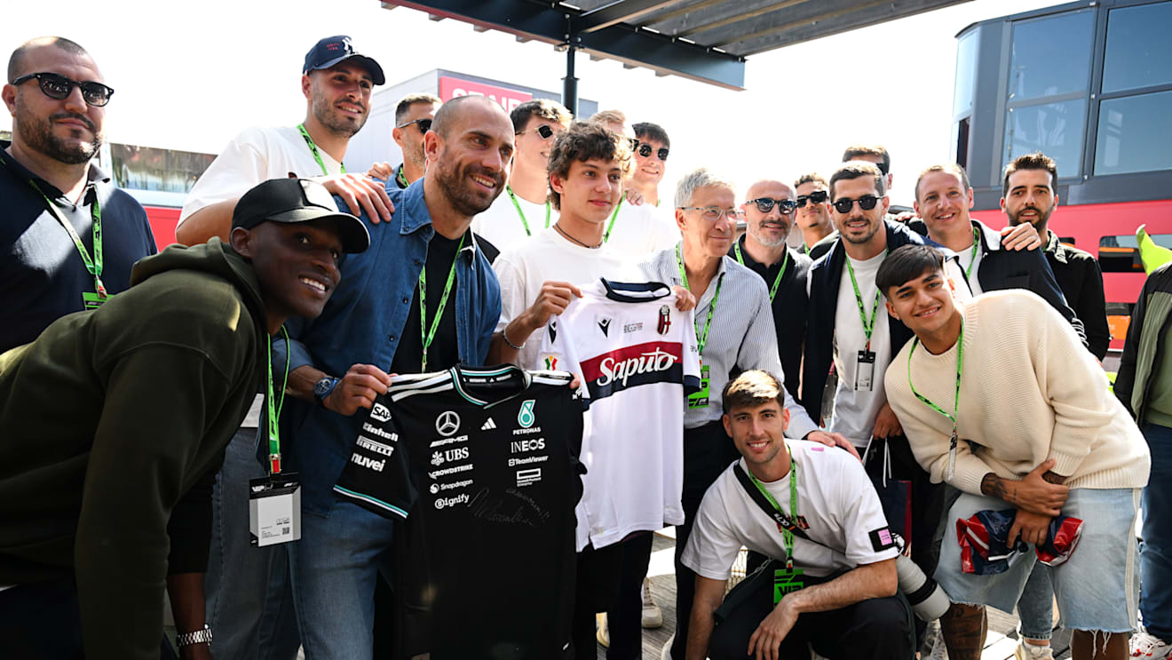Lorenzo De Silvestri of FC Bologna swaps shirts with Kimi Antonelli