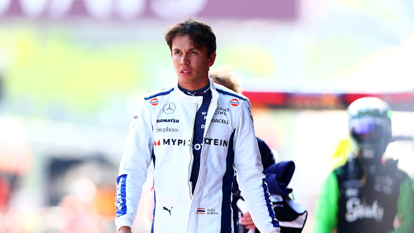 SPIELBERG, AUSTRIA - JUNE 28: 19th placed qualifier Alexander Albon of Thailand and Williams walks in the Pitlane during Sprint Qualifying ahead of the F1 Grand Prix of Austria at Red Bull Ring on June 28, 2024 in Spielberg, Austria. (Photo by Bryn Lennon - Formula 1/Formula 1 via Getty Images)