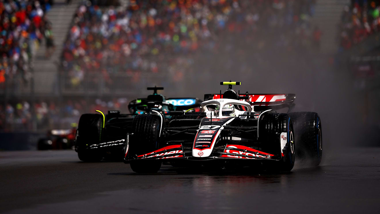 MONTREAL, QUEBEC - JUNE 09: Nico Hulkenberg of Germany driving the (27) Haas F1 VF-24 Ferrari leads Lance Stroll of Canada driving the (18) Aston Martin AMR24 Mercedes on track during the F1 Grand Prix of Canada at Circuit Gilles Villeneuve on June 09, 2024 in Montreal, Quebec. (Photo by Jared C. Tilton - Formula 1/Formula 1 via Getty Images)