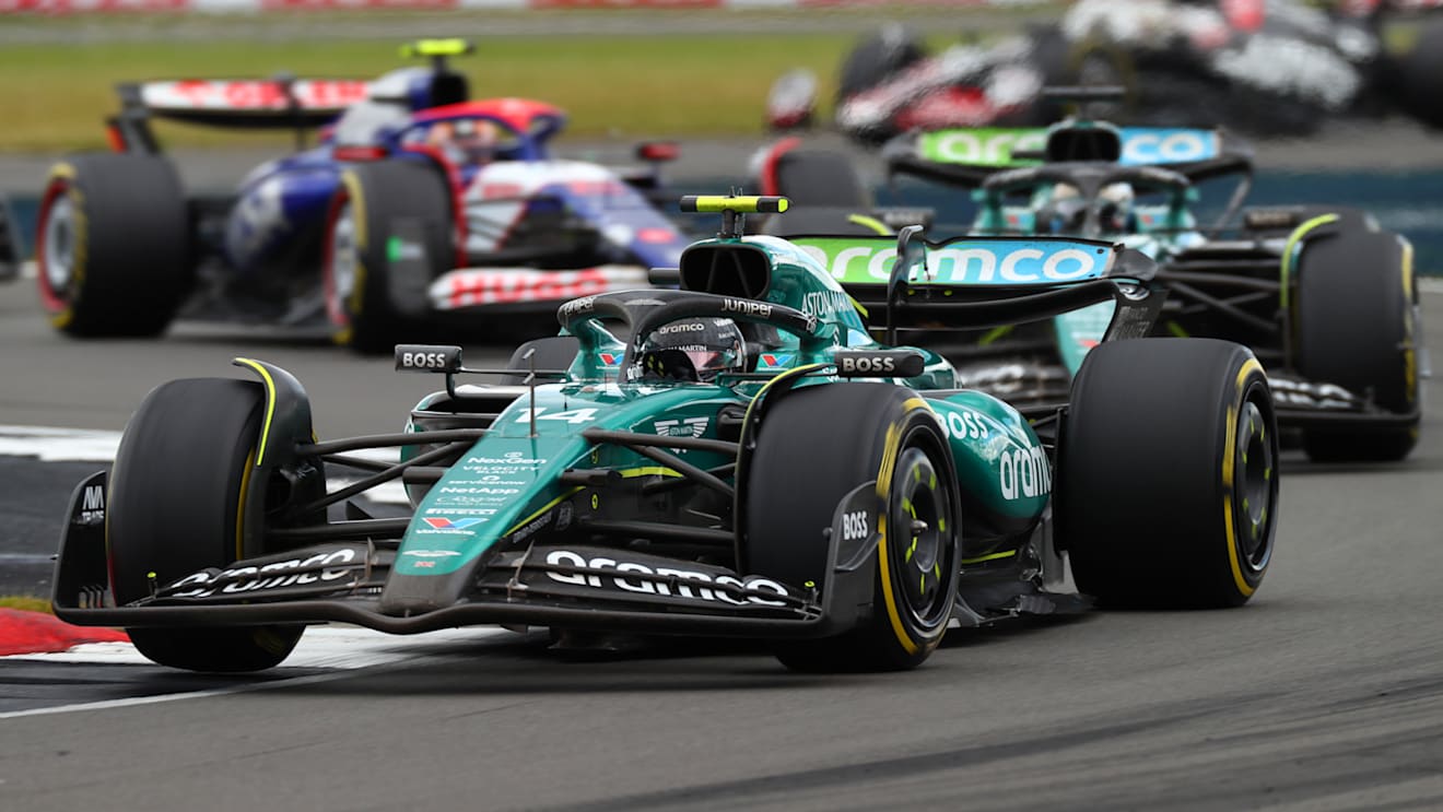 NORTHAMPTON, ENGLAND - JULY 07: Fernando Alonso of Spain driving the (14) Aston Martin AMR24 Mercedes leads Lance Stroll of Canada driving the (18) Aston Martin AMR24 Mercedes during the F1 Grand Prix of Great Britain at Silverstone Circuit on July 07, 2024 in Northampton, England. (Photo by Peter Fox - Formula 1/Formula 1 via Getty Images)