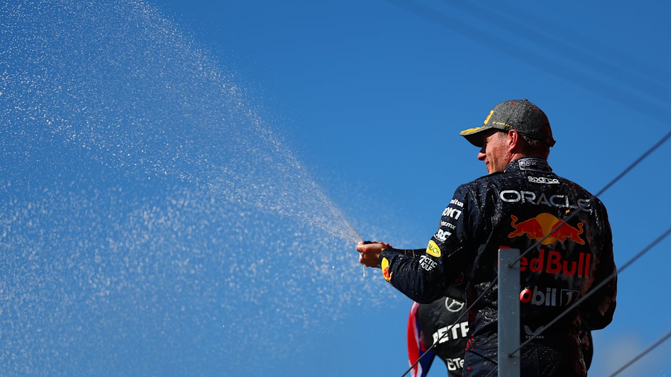 NORTHAMPTON, ENGLAND - JULY 07: Second placed Max Verstappen of the Netherlands and Oracle Red Bull Racing celebrates on the podium during the F1 Grand Prix of Great Britain at Silverstone Circuit on July 07, 2024 in Northampton, England. (Photo by Bryn Lennon - Formula 1/Formula 1 via Getty Images)