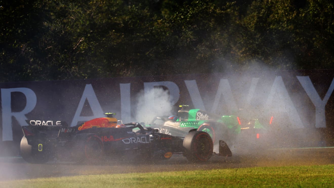 BUDAPEST, HUNGARY - JULY 19: Zhou Guanyu of China driving the (24) Kick Sauber C44 Ferrari spins in front of Sergio Perez of Mexico driving the (11) Oracle Red Bull Racing RB20 during practice ahead of the F1 Grand Prix of Hungary at Hungaroring on July 19, 2024 in Budapest, Hungary. (Photo by Mark Thompson/Getty Images)