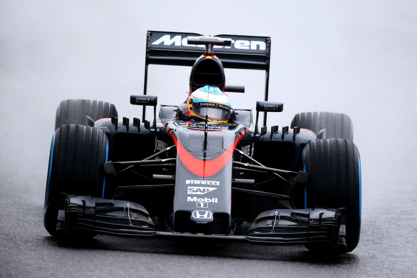 SUZUKA, JAPAN - SEPTEMBER 25:  Fernando Alonso of Spain and McLaren Honda drives during practice