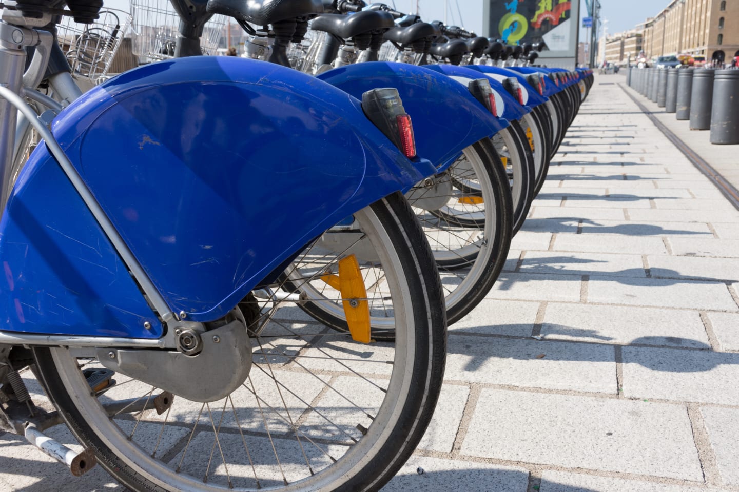 Close Up Of A Row Of Bicycles With Royal Blue And White Fenders To Rent In Vieux Port Or Old Port