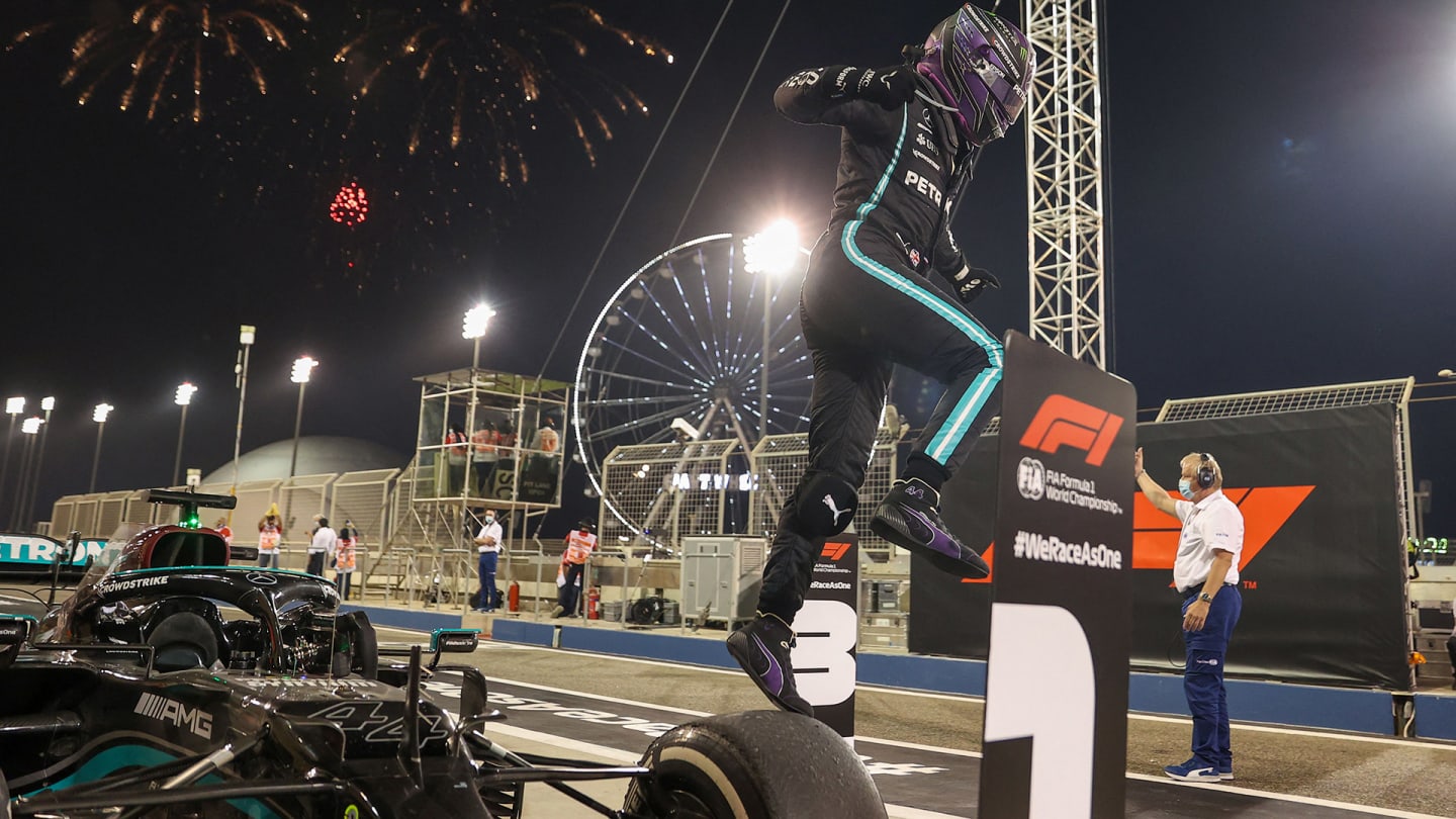 Mercedes' British driver Lewis Hamilton celebrates after winning the Bahrain Formula One Grand Prix