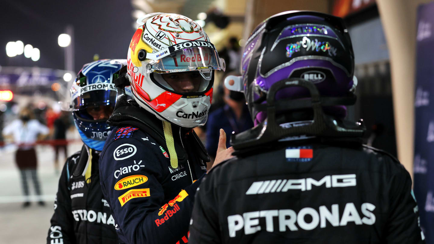 Max Verstappen (NLD) Red Bull Racing and Lewis Hamilton (GBR) Mercedes AMG F1 in qualifying parc