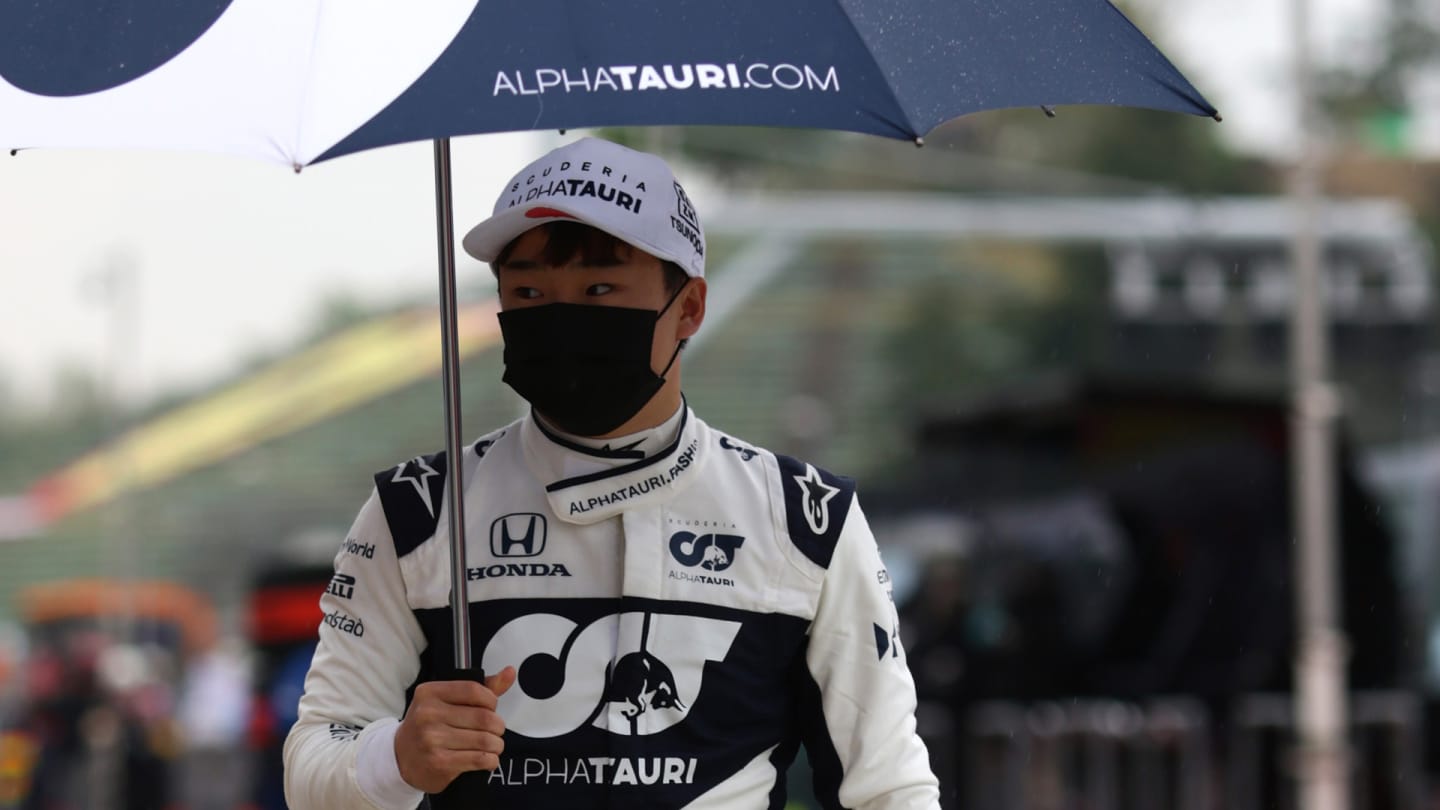 IMOLA, ITALY - APRIL 18: Yuki Tsunoda of Japan and Scuderia AlphaTauri walks to the grid ahead of