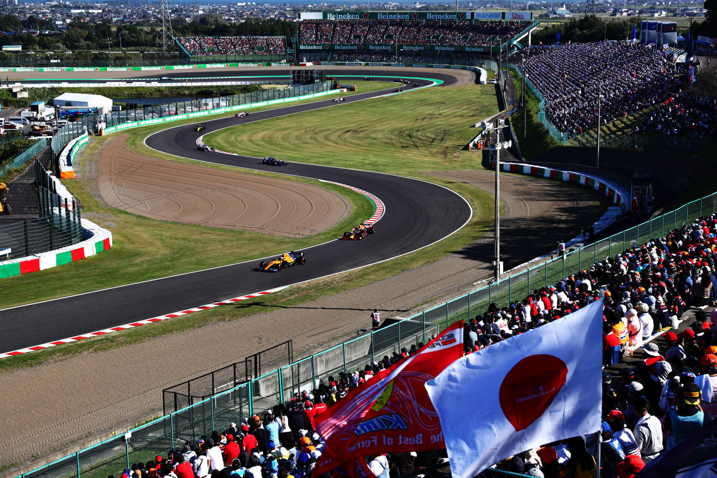 SUZUKA, JAPAN - OCTOBER 13: Lando Norris of Great Britain driving the (4) McLaren F1 Team MCL34