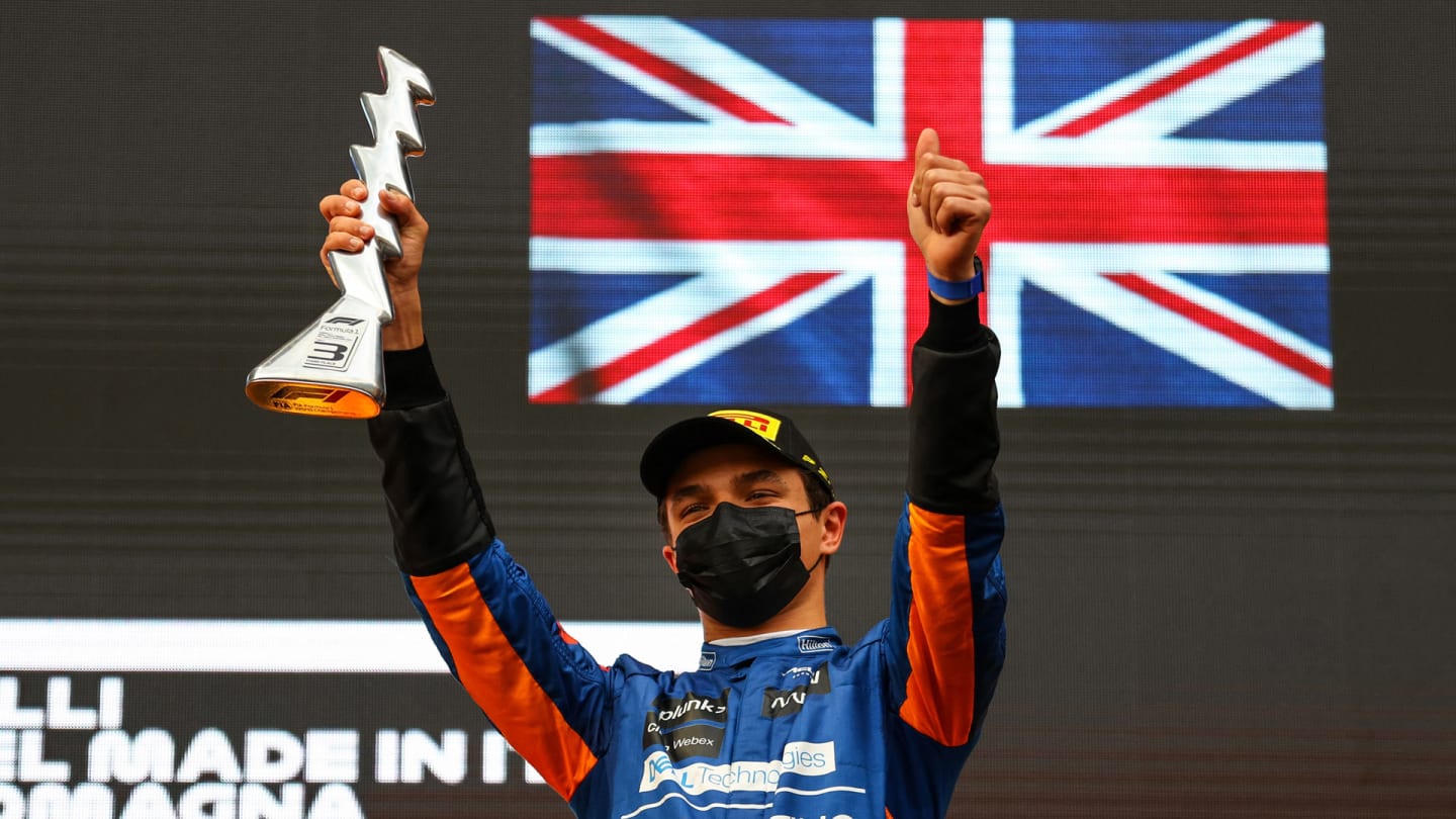 Third-placed McLaren's British driver Lando Norris celebrates on the podium after the Emilia