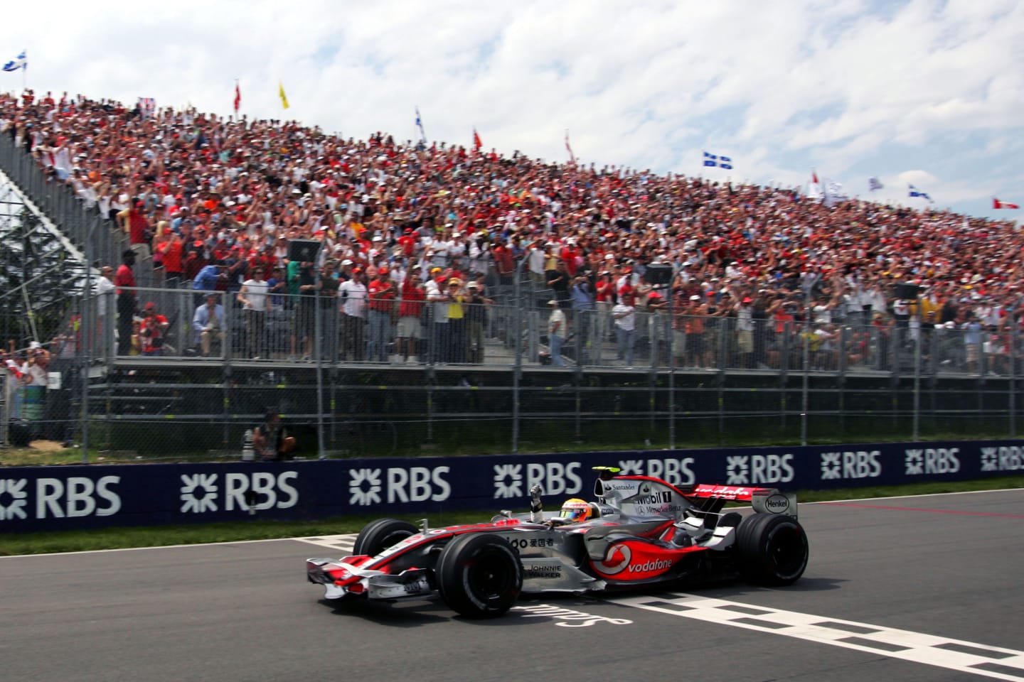 Race winner Lewis Hamilton (GBR) McLaren Mercedes MP4/22 takes the chequered flag.
Formula One