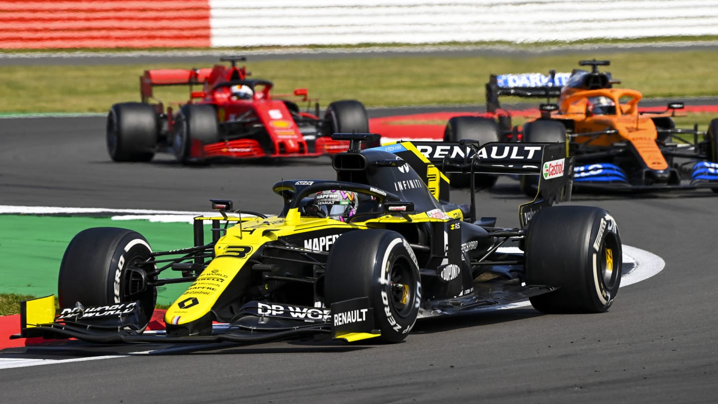 Daniel Ricciardo, Renault R.S.20, leads Carlos Sainz, McLaren MCL35, and Sebastian Vettel, Ferrari
