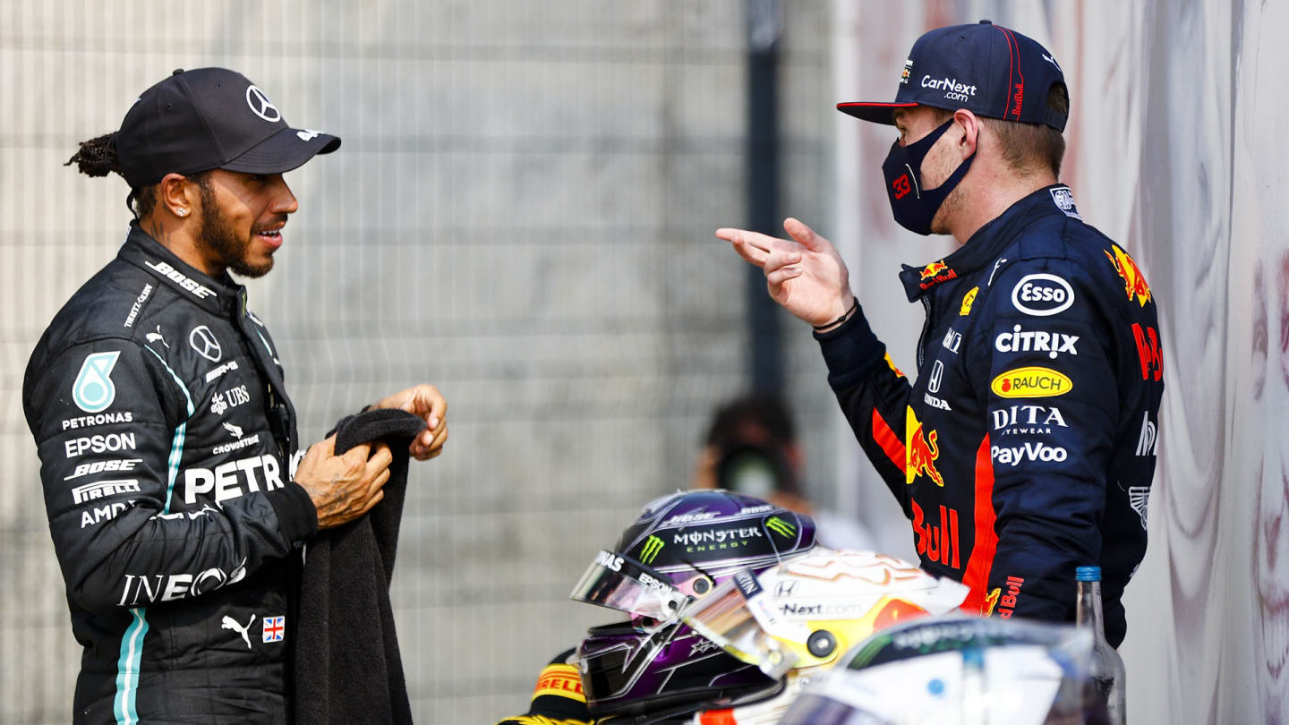 Lewis Hamilton, Mercedes-AMG Petronas F1, 2nd position, talks with Max Verstappen, Red Bull Racing,