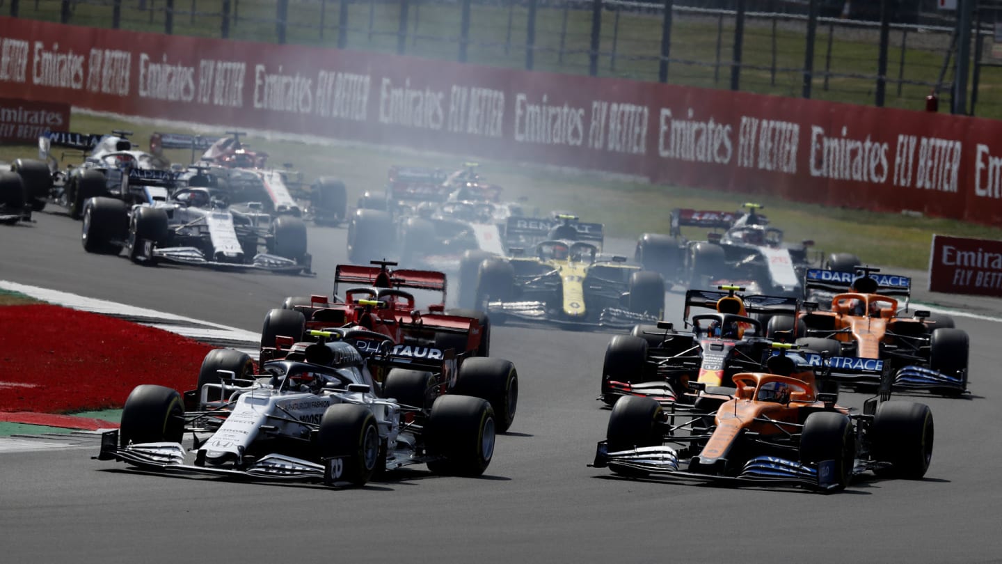 Drivers take the first corner at the start of the 70th Anniversary Formula One Grand Prix at the