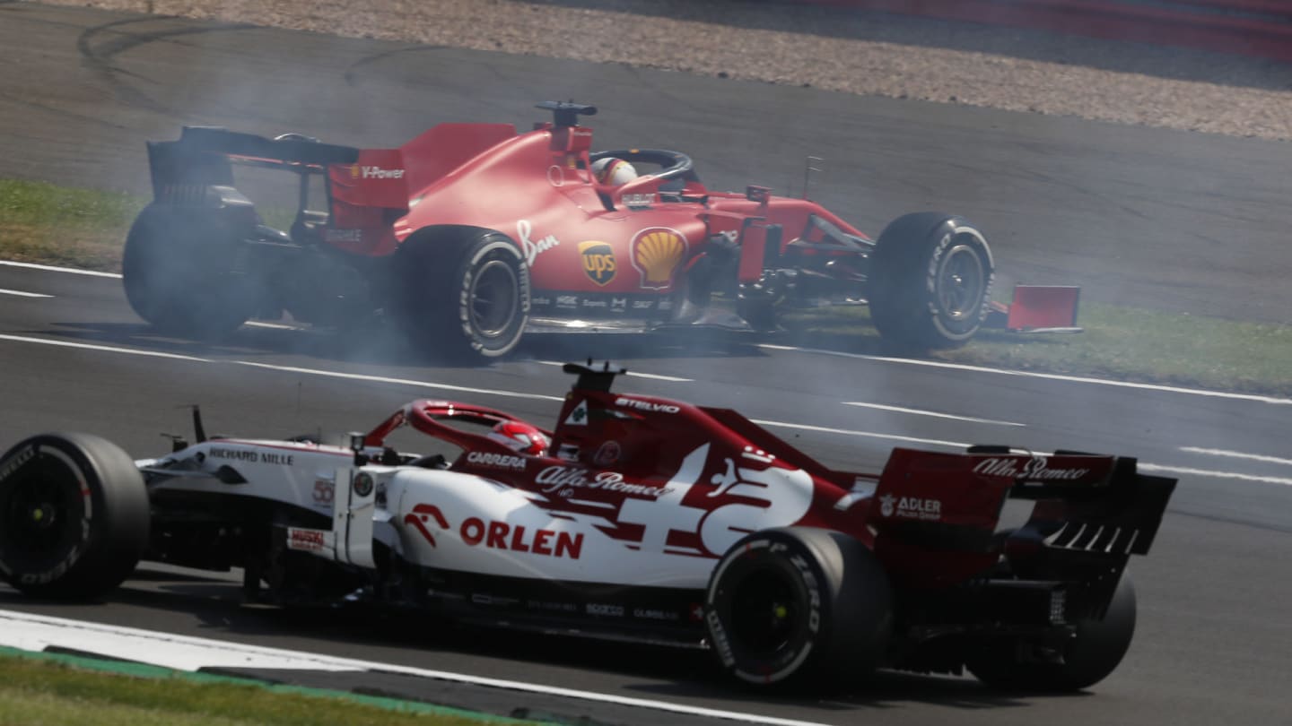 Ferrari driver Sebastian Vettel of Germany, top, spins off the track during the 70th Anniversary Formula One Grand Prix at the Silverstone circuit, Silverstone, England, Sunday, Aug. 9, 2020. (AP Photo/Frank Augstein, Pool)
