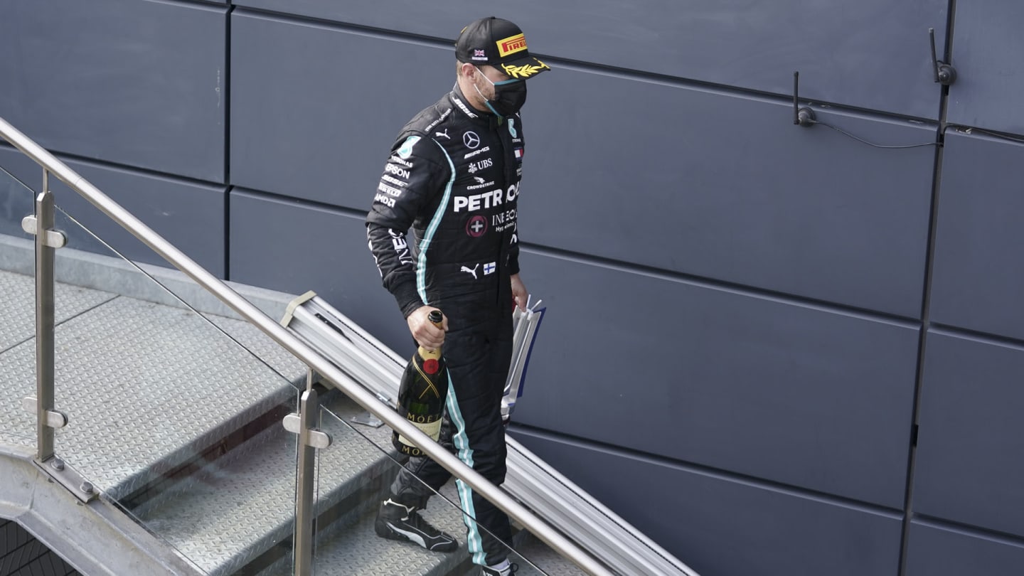 Finnish Formula One driver Valtteri Bottas of Mercedes-AMG Petronas leaves the podium after the