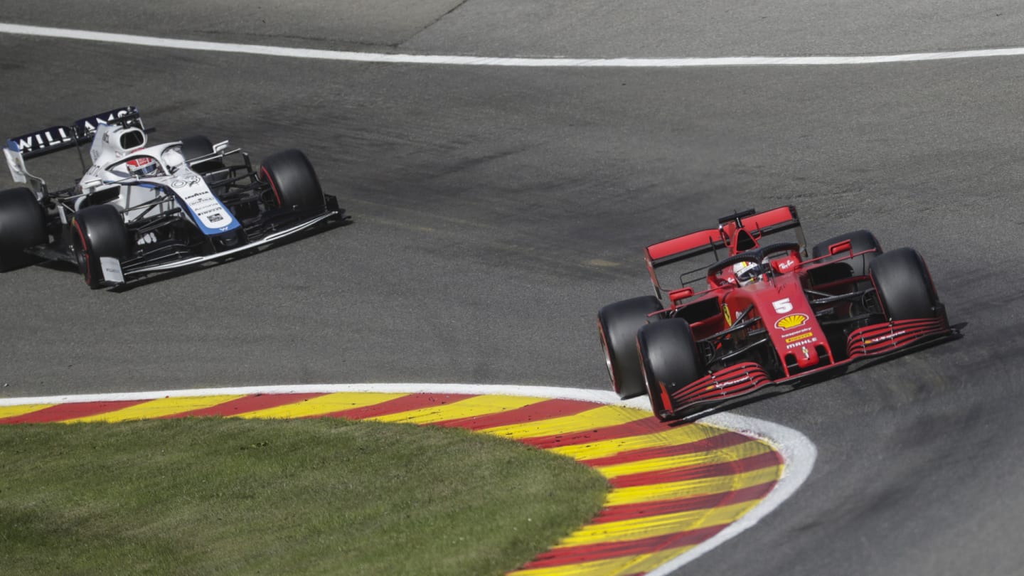 German Formula One driver Sebastian Vettel of Scuderia Ferrari (R) and British Formula One driver