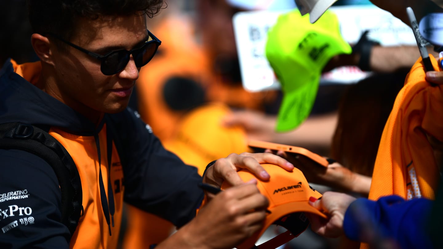 NORTHAMPTON, ENGLAND - JULY 03: Lando Norris of Great Britain and McLaren greets fans as he arrives
