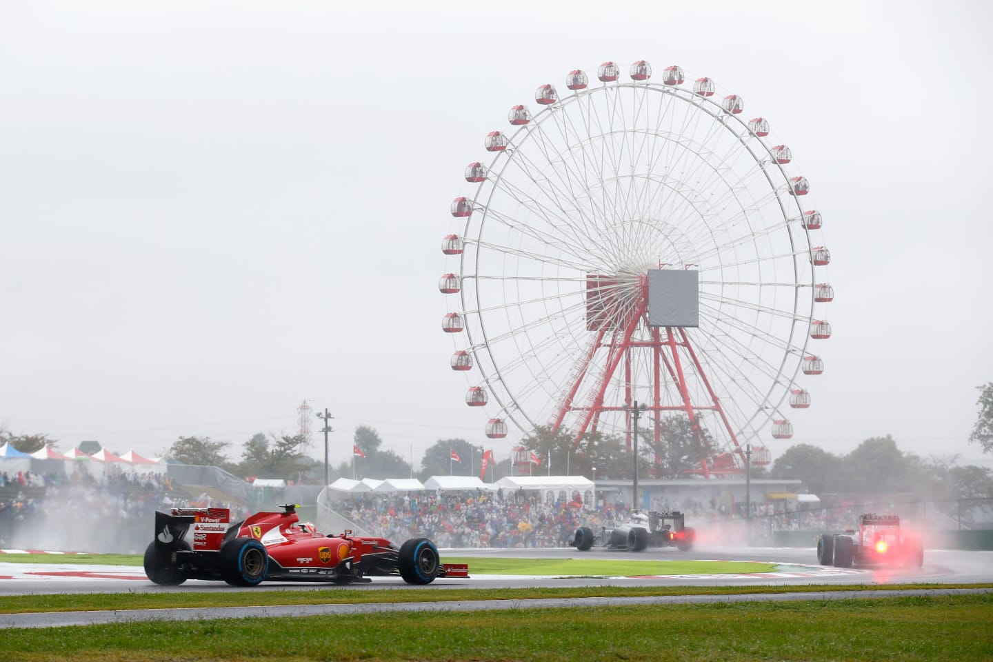 SUZUKA, JAPAN - OCTOBER 05:  Kimi Raikkonen of Finland and Ferrari drives during the Japanese