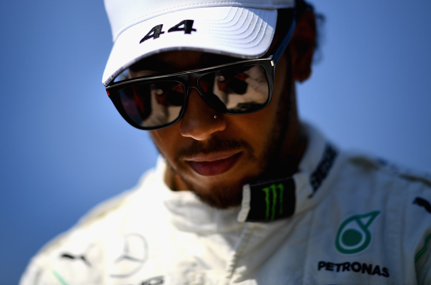 MELBOURNE, AUSTRALIA - MARCH 17: Lewis Hamilton of Great Britain and Mercedes GP looks on before