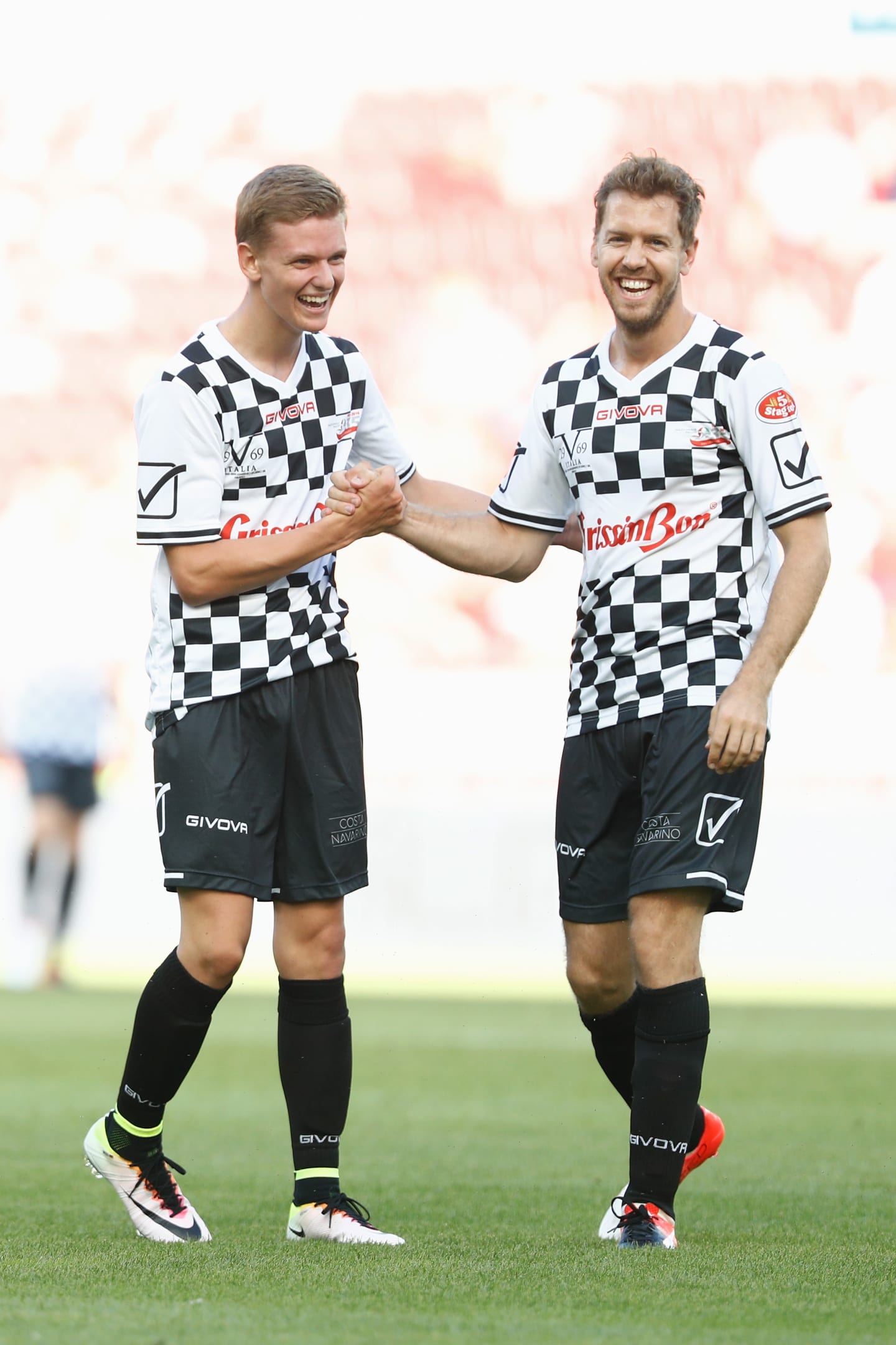MAINZ, GERMANY - JULY 27:  Mick Schumacher, son of Michael Schumacher, greets Sebastian Vettel (R)