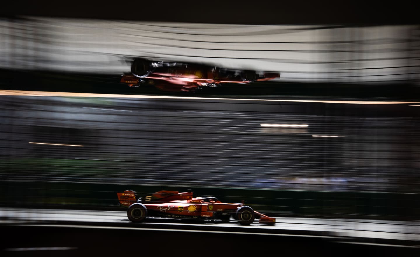 SINGAPORE, SINGAPORE - SEPTEMBER 21: Sebastian Vettel of Germany driving the (5) Scuderia Ferrari