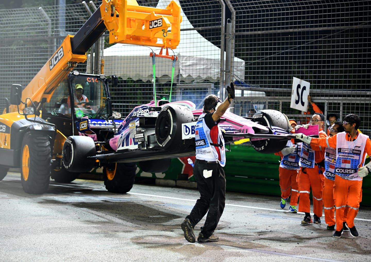 SINGAPORE, SINGAPORE - SEPTEMBER 22: The car of Sergio Perez of Mexico and Racing Point is removed