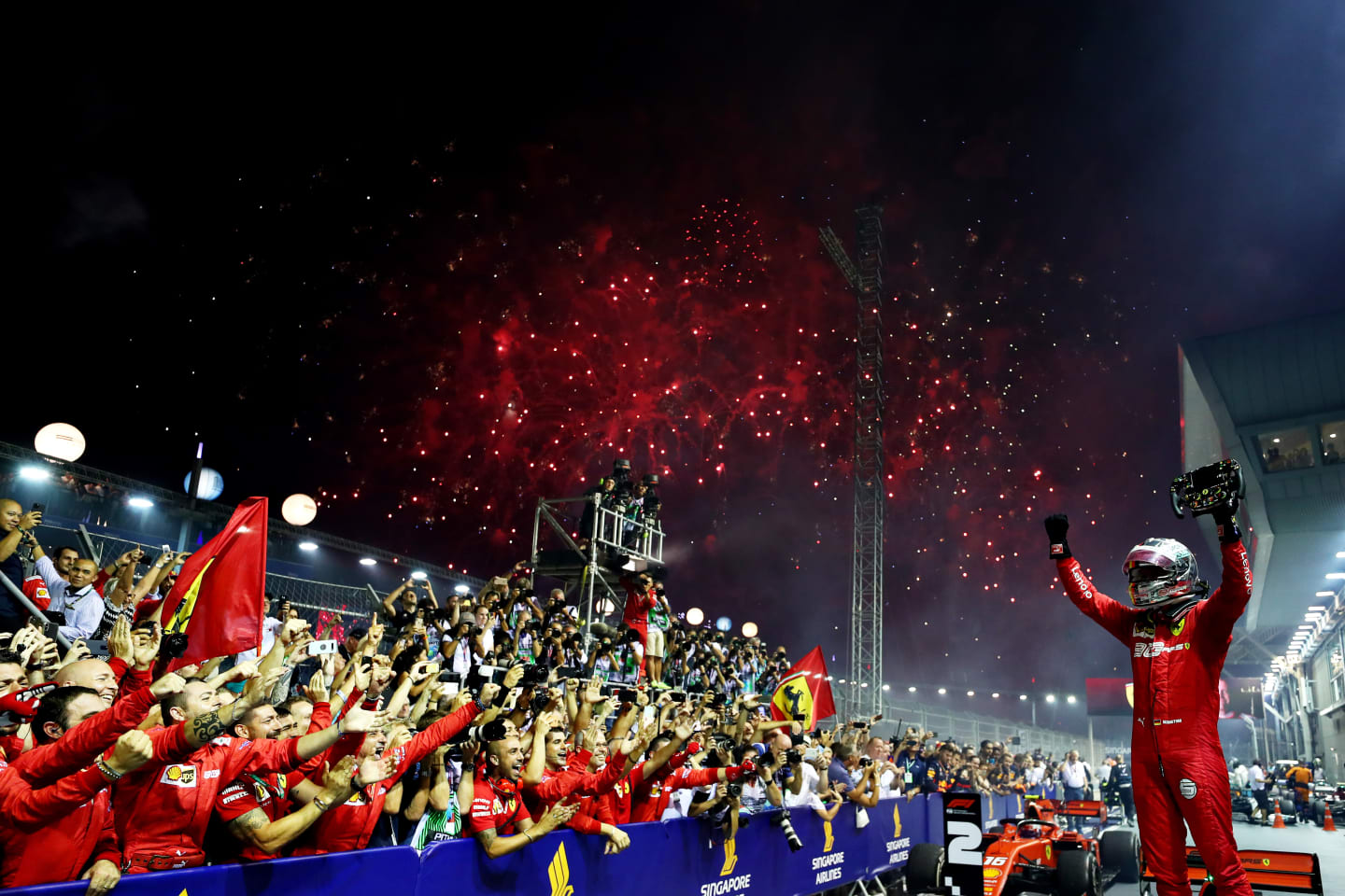 SINGAPORE, SINGAPORE - SEPTEMBER 22: Race winner Sebastian Vettel of Germany and Ferrari celebrates in parc ferme during the F1 Grand Prix of Singapore at Marina Bay Street Circuit on September 22, 2019 in Singapore. (Photo by Lars Baron/Getty Images)