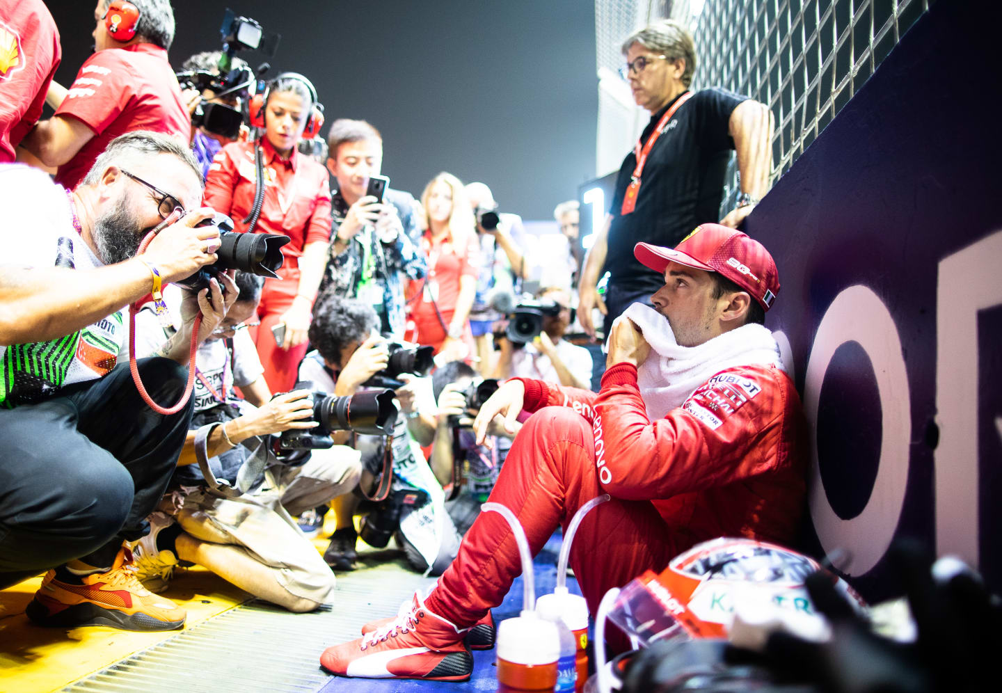 SINGAPORE, SINGAPORE - SEPTEMBER 22: Charles Leclerc of Monaco and Ferrari prepares to drive on the grid before the F1 Grand Prix of Singapore at Marina Bay Street Circuit on September 22, 2019 in Singapore. (Photo by Lars Baron/Getty Images)