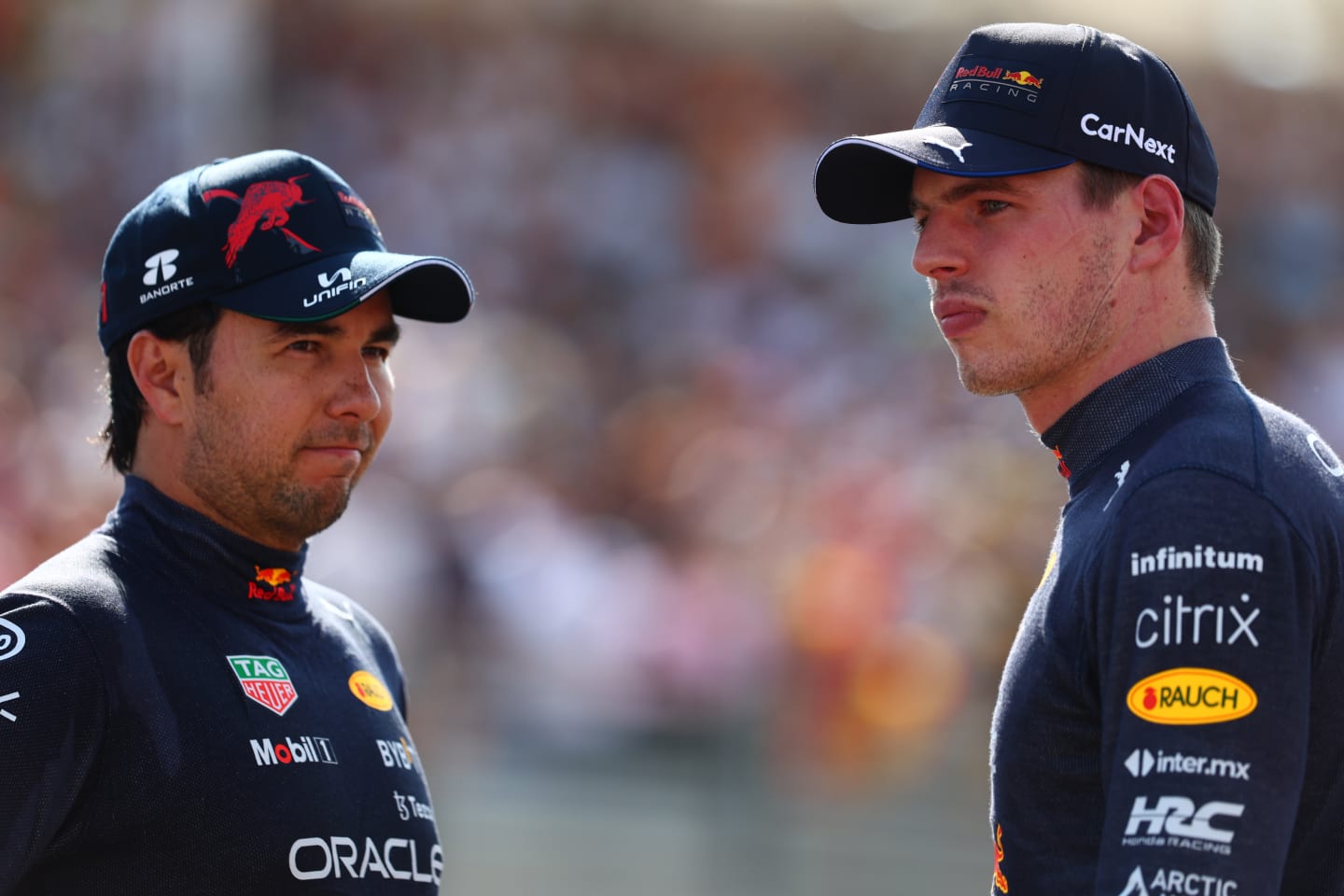 LE CASTELLET, FRANCE - JULY 23: Second placed qualifier Max Verstappen of the Netherlands and Oracle Red Bull Racing and Third placed qualifier Sergio Perez of Mexico and Oracle Red Bull Racing talk in parc ferme during qualifying ahead of the F1 Grand Prix of France at Circuit Paul Ricard on July 23, 2022 in Le Castellet, France. (Photo by Mark Thompson/Getty Images)