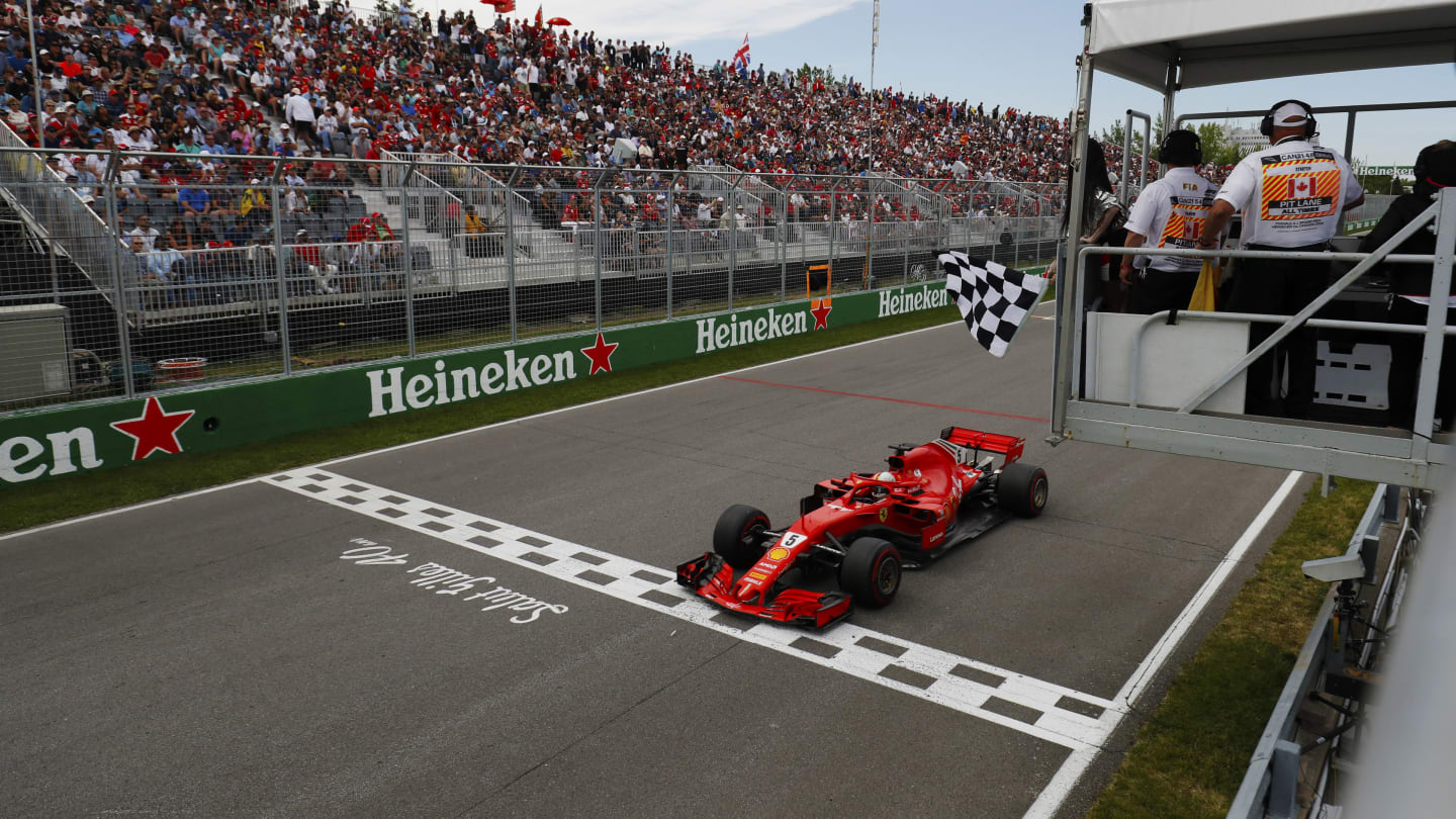 CIRCUIT GILLES-VILLENEUVE, CANADA - JUNE 10: Sebastian Vettel, Ferrari SF71H, takes the chequered