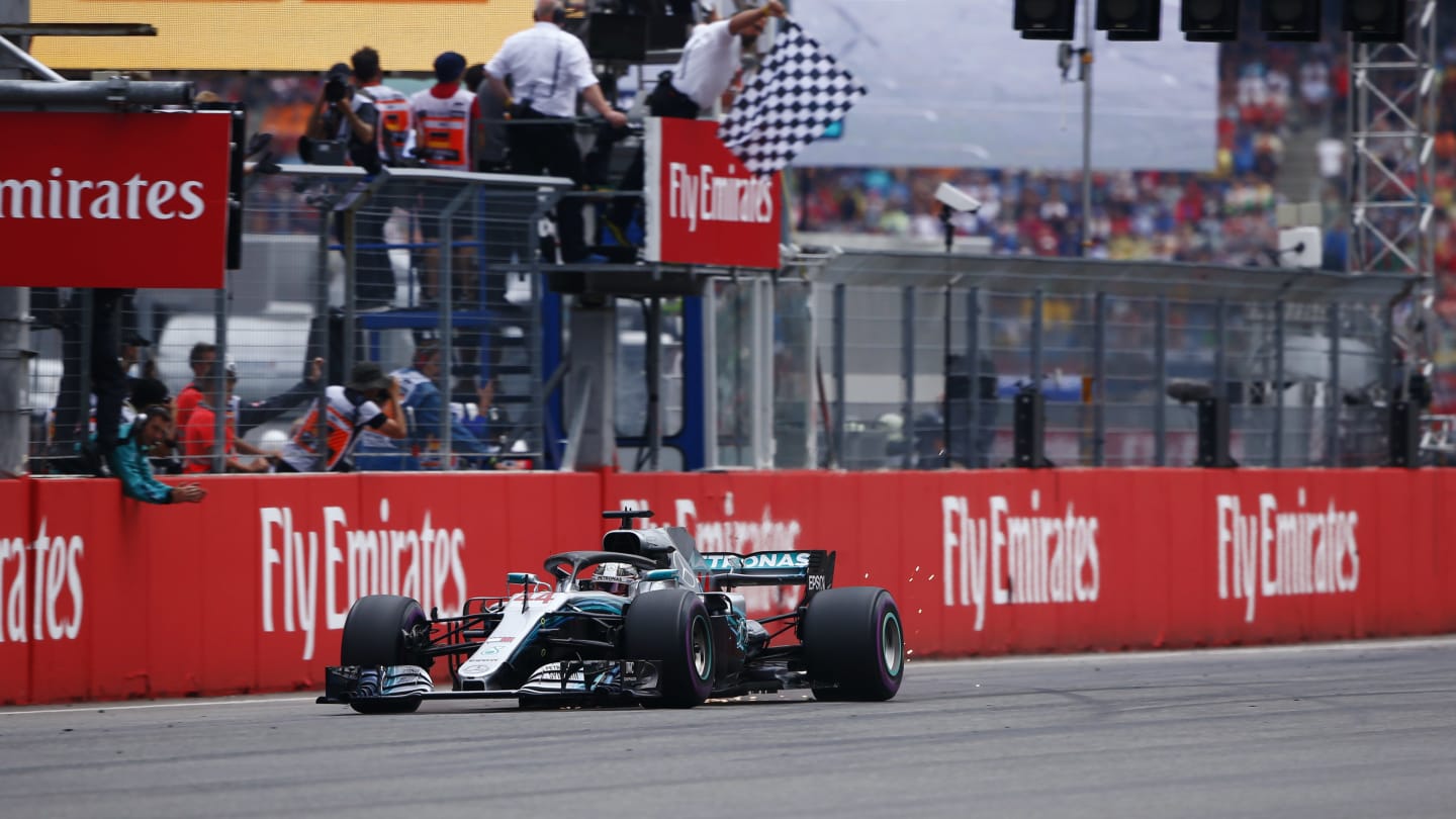 HOCKENHEIMRING, GERMANY - JULY 22: Lewis Hamilton, Mercedes AMG F1 W09, strikes sparks as he takes