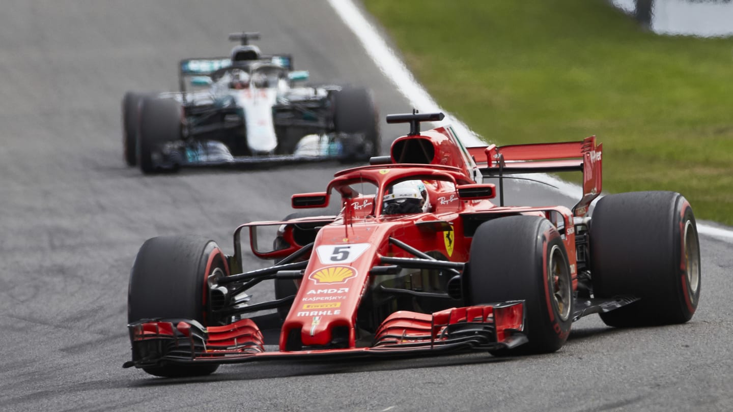 SPA-FRANCORCHAMPS, BELGIUM - AUGUST 26: Sebastian Vettel, Ferrari SF71H, leads Lewis Hamilton,